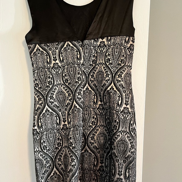 Fitted black and silver dress with beaded shoulder treatment. - Picture 3 of 4